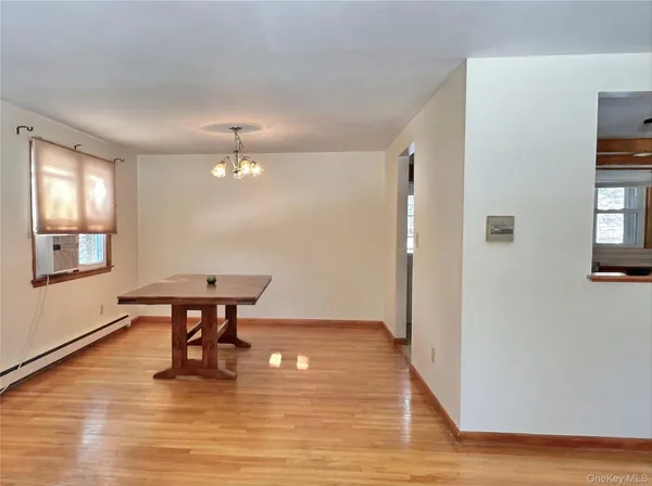 a view of a livingroom with furniture and wooden floor