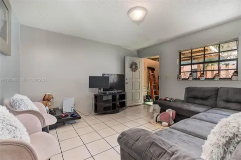 a bedroom with furniture and a flat screen tv