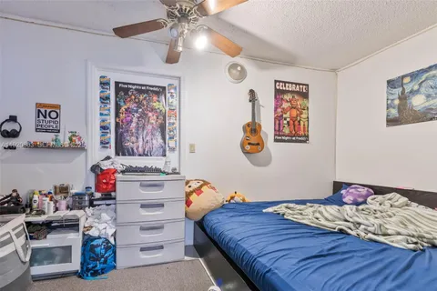 a bedroom with a bed and cabinets