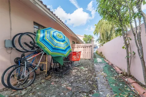 a view of a car park in front of a house