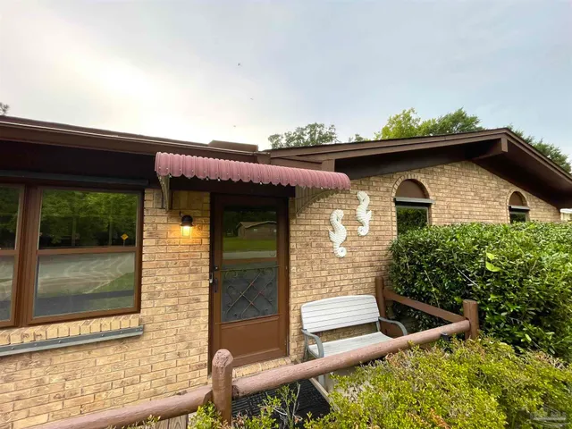 a kitchen with cabinets stainless steel appliances and sink