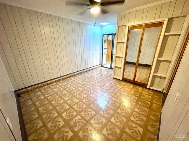 a front view of a house with swimming pool and sitting area