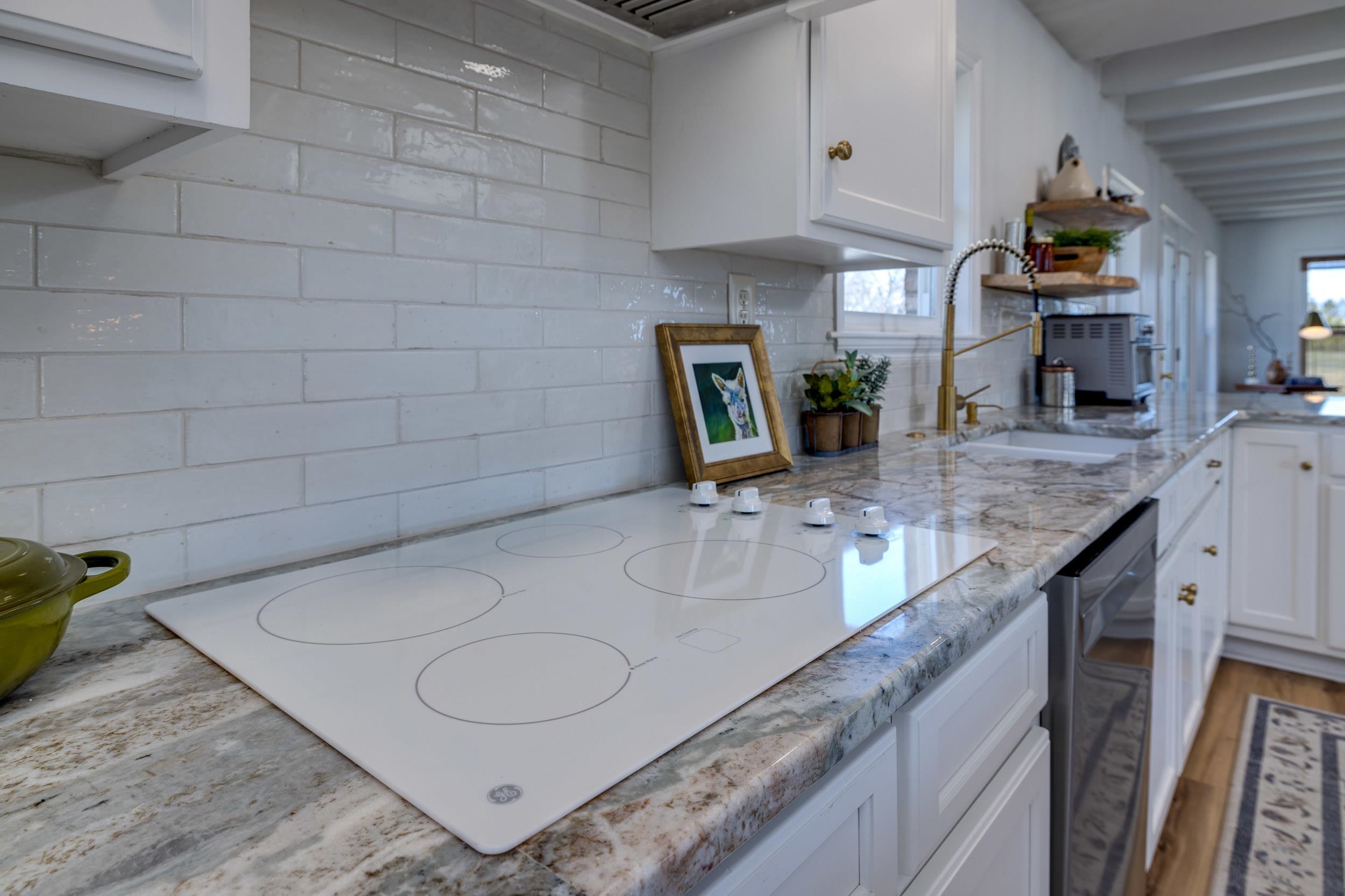901 Riverside Avenue Grottoes, VA 24441 - Photo 15 of 75 a bathroom with a granite countertop sink a toilet and mirror
