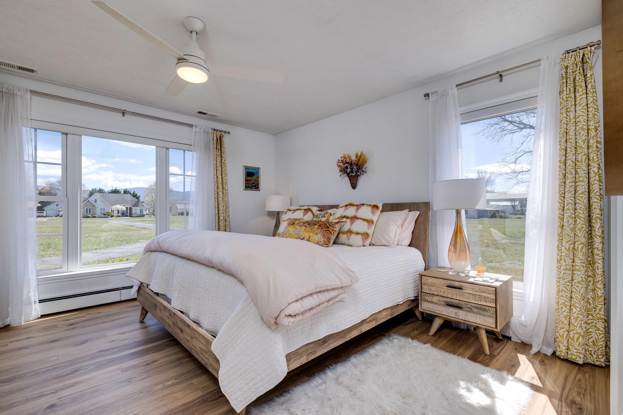 901 Riverside Avenue Grottoes, VA 24441 - Photo 40 of 75 a bed sitting in a spacious bedroom next to a window