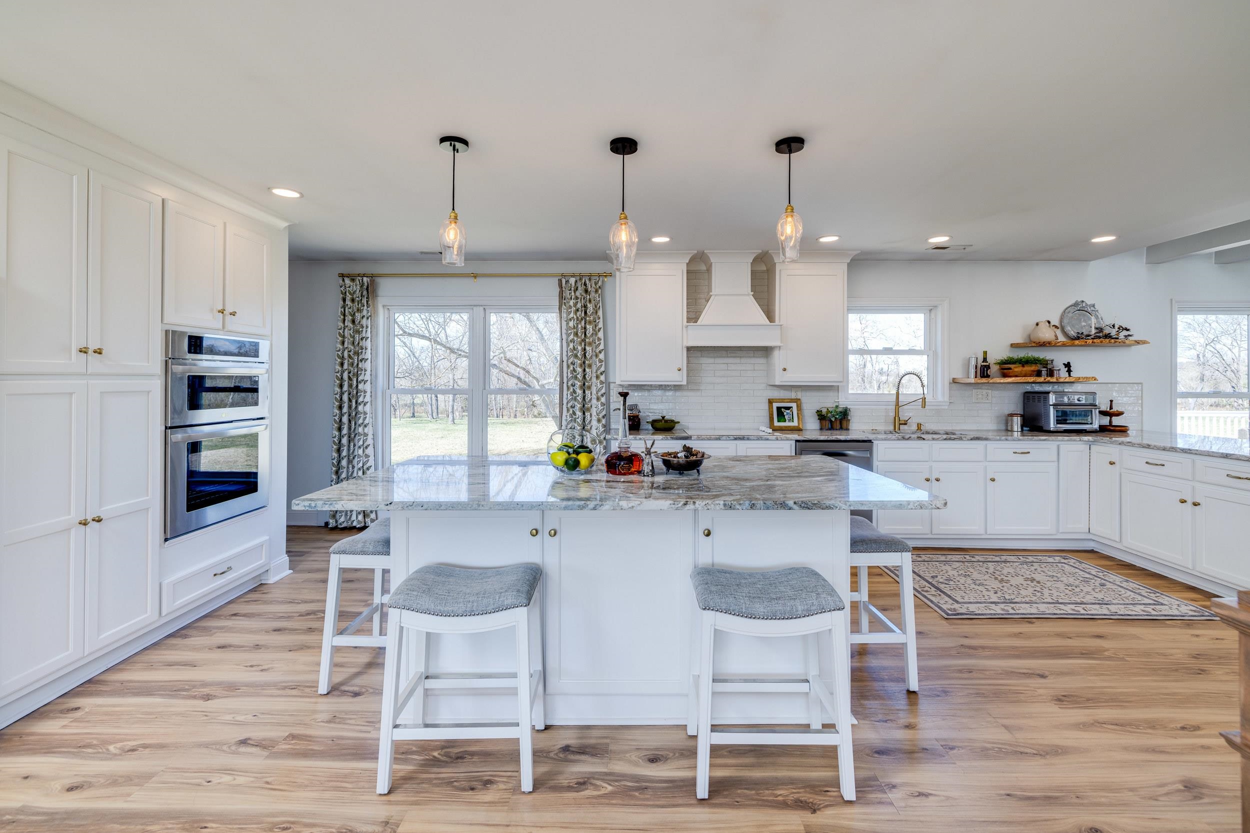 901 Riverside Avenue Grottoes, VA 24441 - Photo 5 of 75 a kitchen with stainless steel appliances kitchen island granite countertop a dining table chairs and sink
