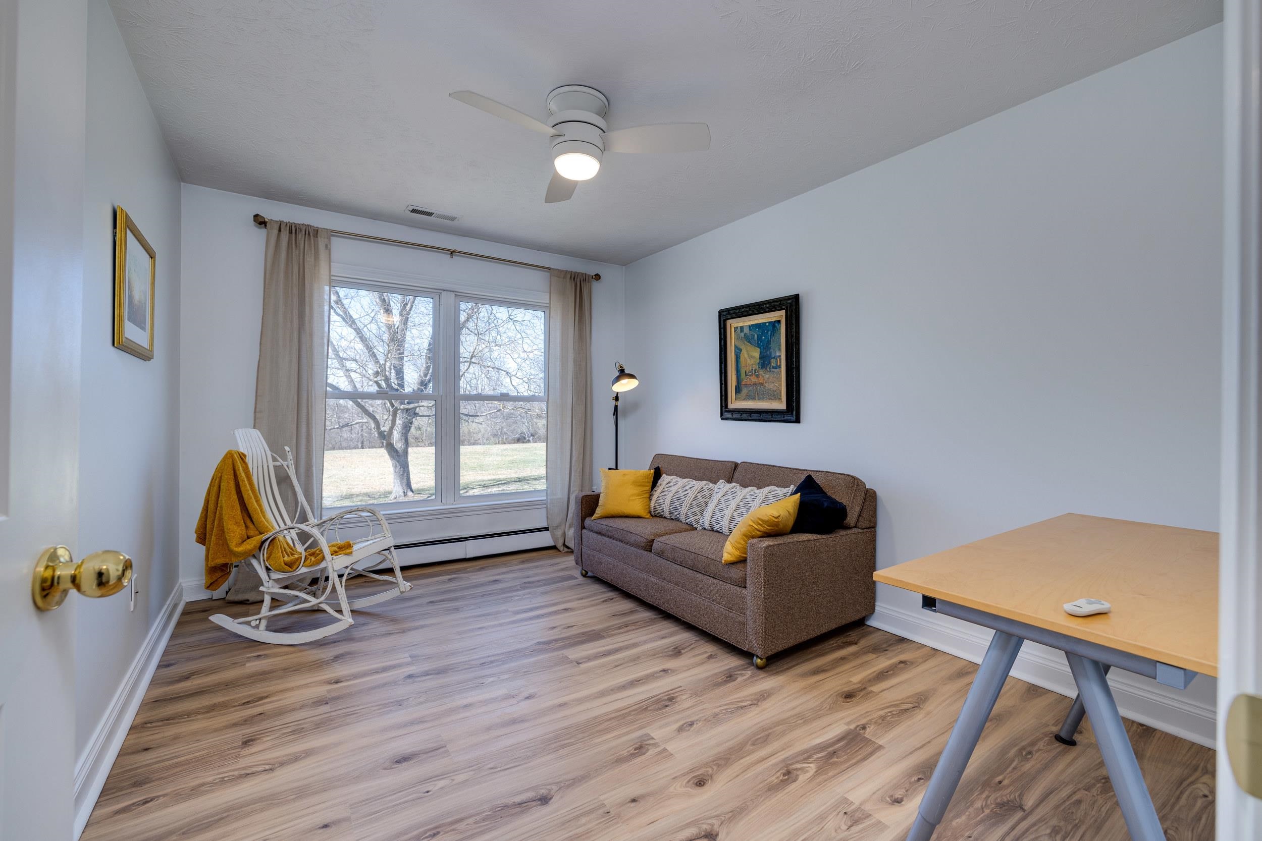 901 Riverside Avenue Grottoes, VA 24441 - Photo 53 of 75 a living room with furniture a table and wooden floor