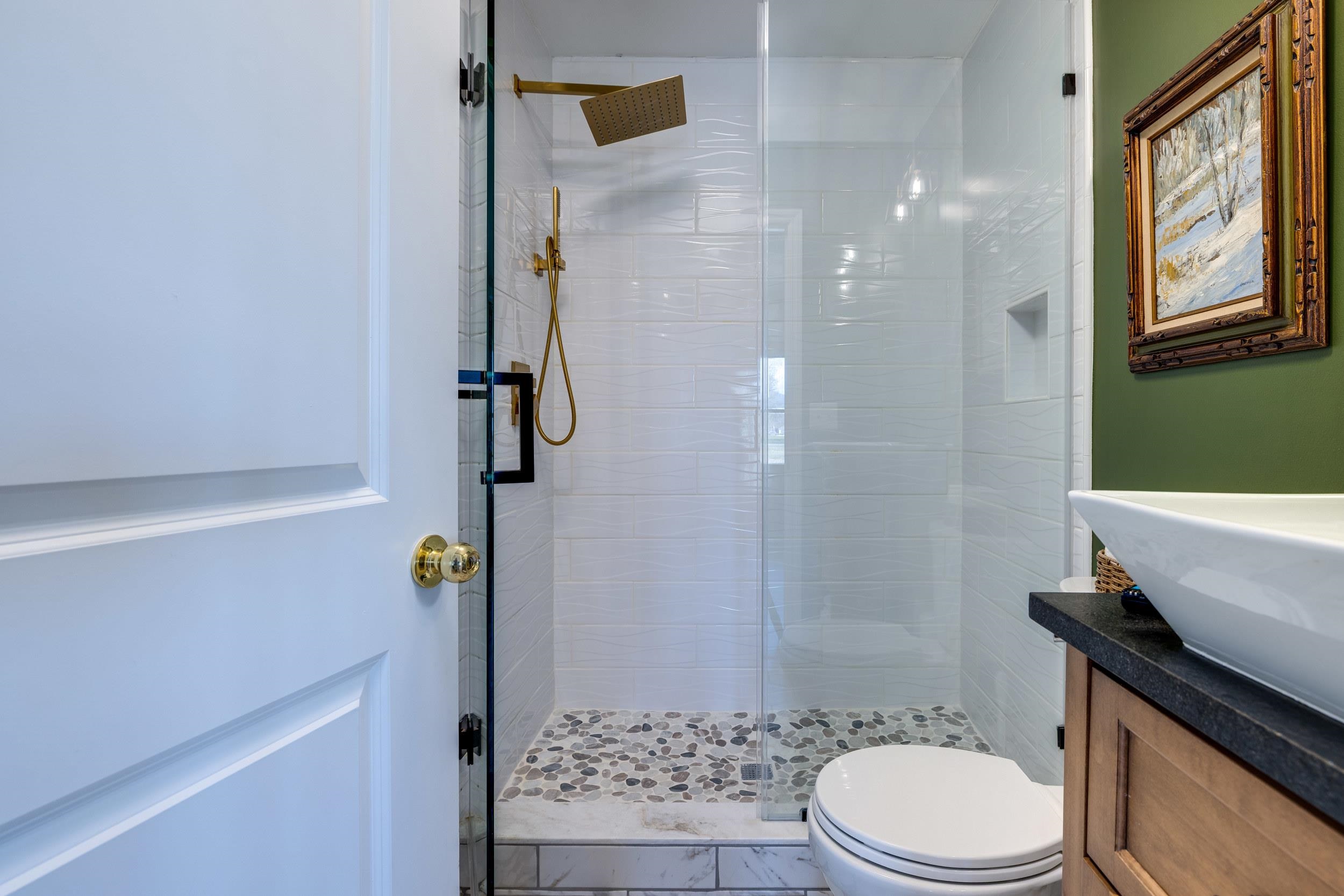 901 Riverside Avenue Grottoes, VA 24441 - Photo 56 of 75 a bathroom with a sink a toilet and shower