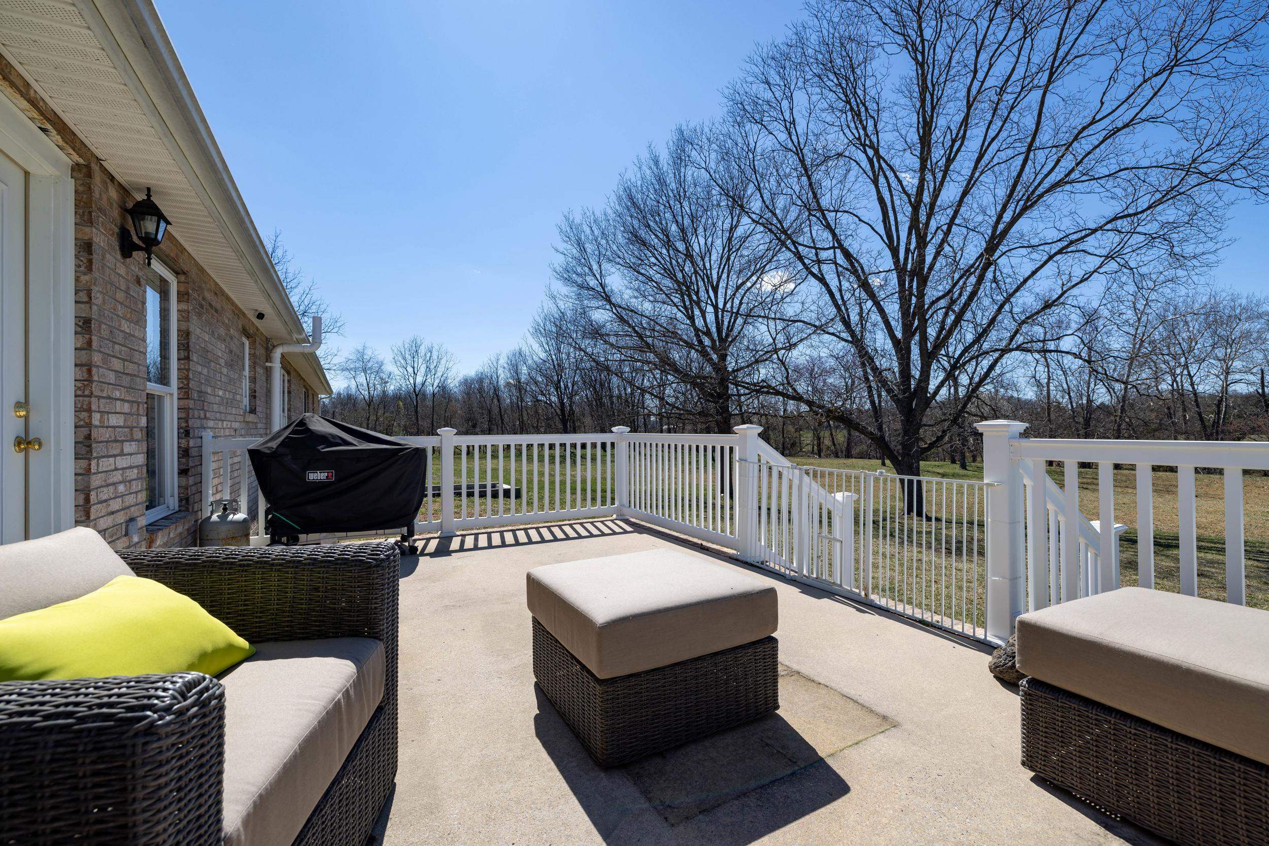 901 Riverside Avenue Grottoes, VA 24441 - Photo 70 of 75 a view of a roof deck with couches and wooden fence