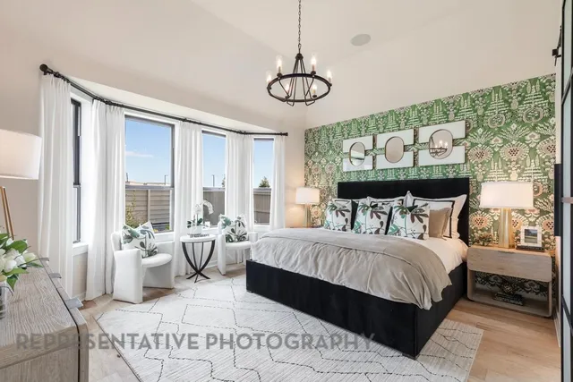 a room with furniture a flat screen tv and a potted plant