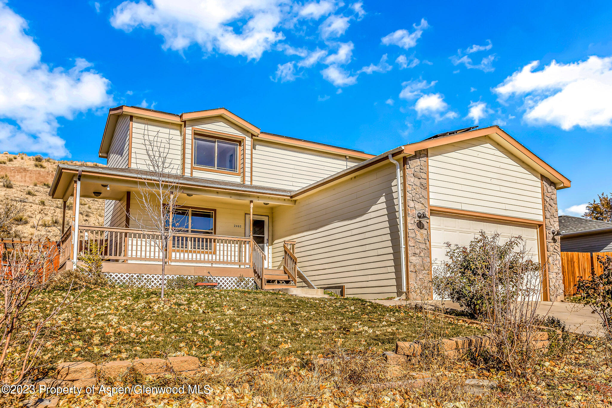 2462 Pioneer Way Rifle, CO 81650 - Photo 3 of 29 a view of a house with a yard