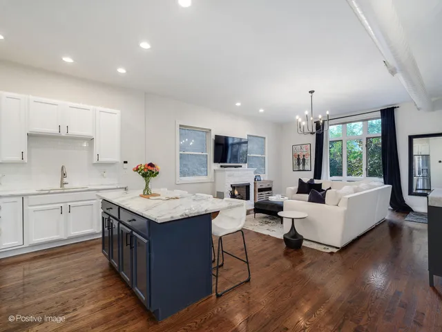 a kitchen with sink and cabinets