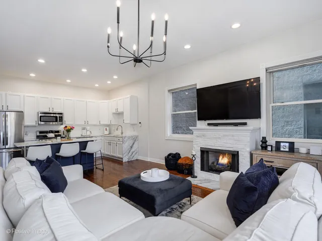 a living room with furniture fireplace and a flat screen tv