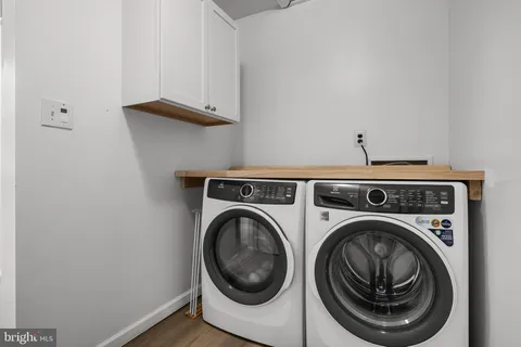 a view of a hallway with washer and dryer