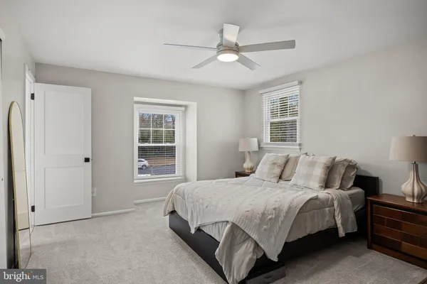 a bedroom with a bed and a cabinets