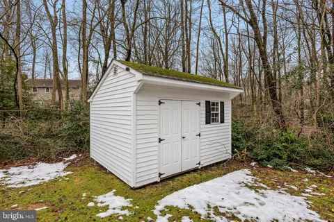 a view of a deck with a table and chairs with wooden floor and fence