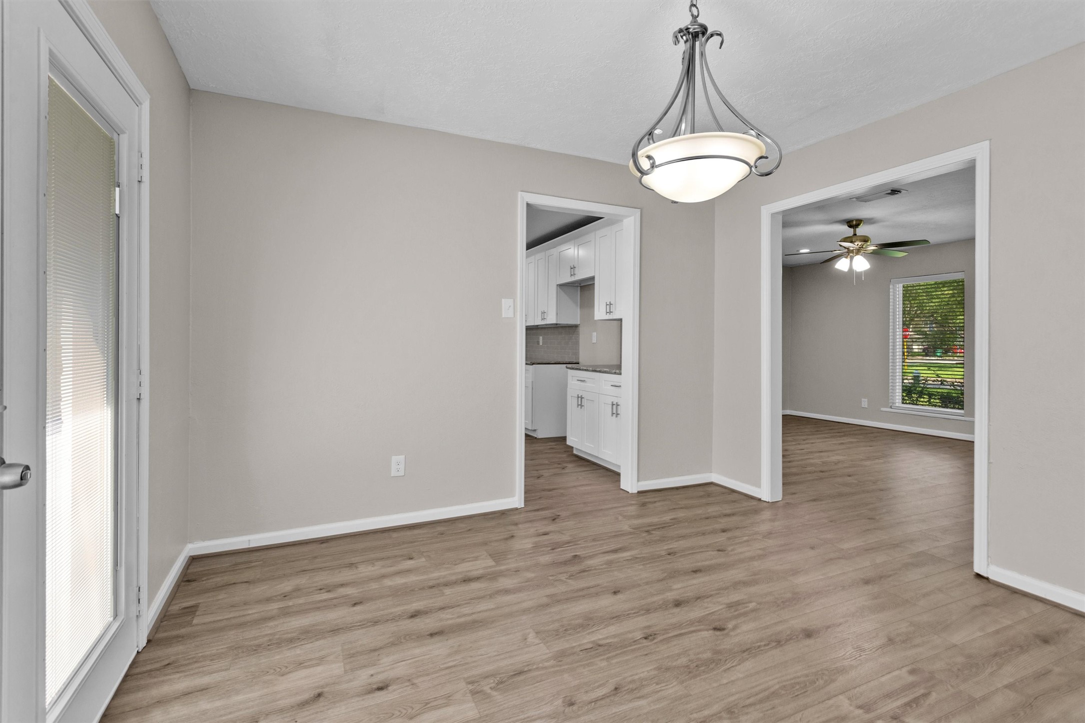 9115 Godstone Lane Spring, TX 77379 - Photo 10 of 46 The formal dining room features a stylish overhead light fixture and leads into the updated kitchen.