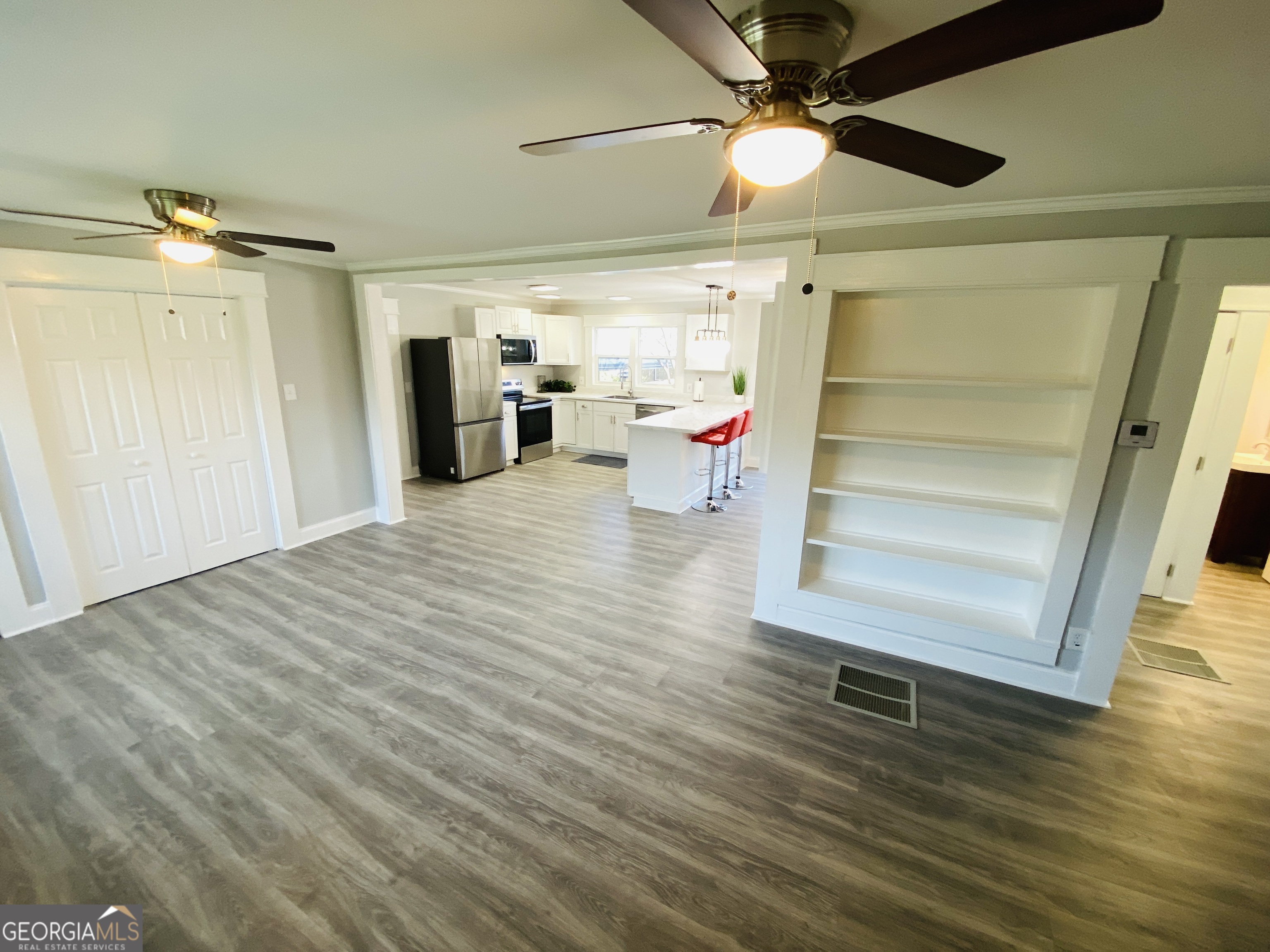 288 Davis Avenue Toccoa, GA 30577 - Photo 11 of 36 a view of a hallway with wooden floor and cabinet