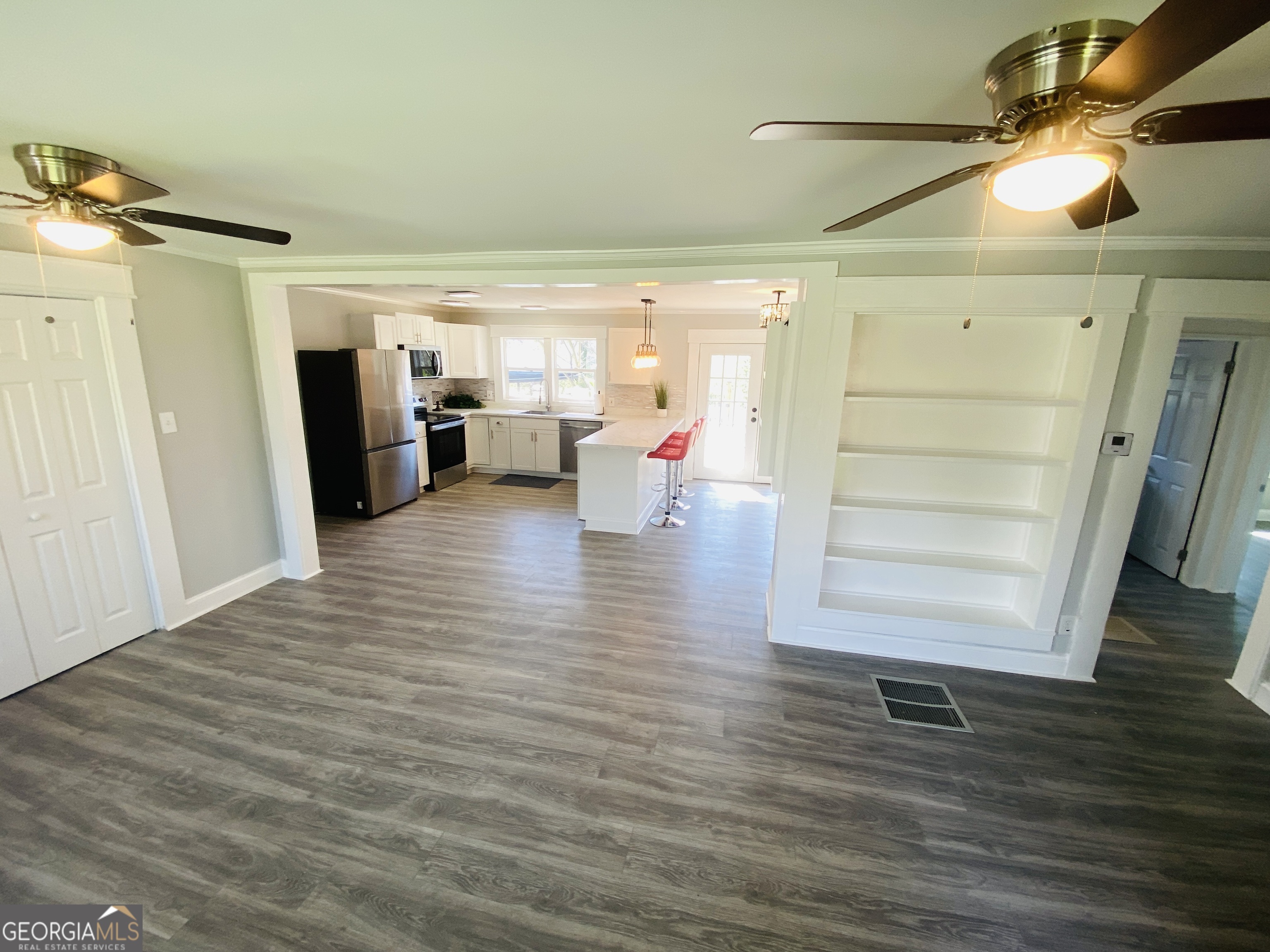 288 Davis Avenue Toccoa, GA 30577 - Photo 19 of 36 a view of walk in closet with clothes and shoes