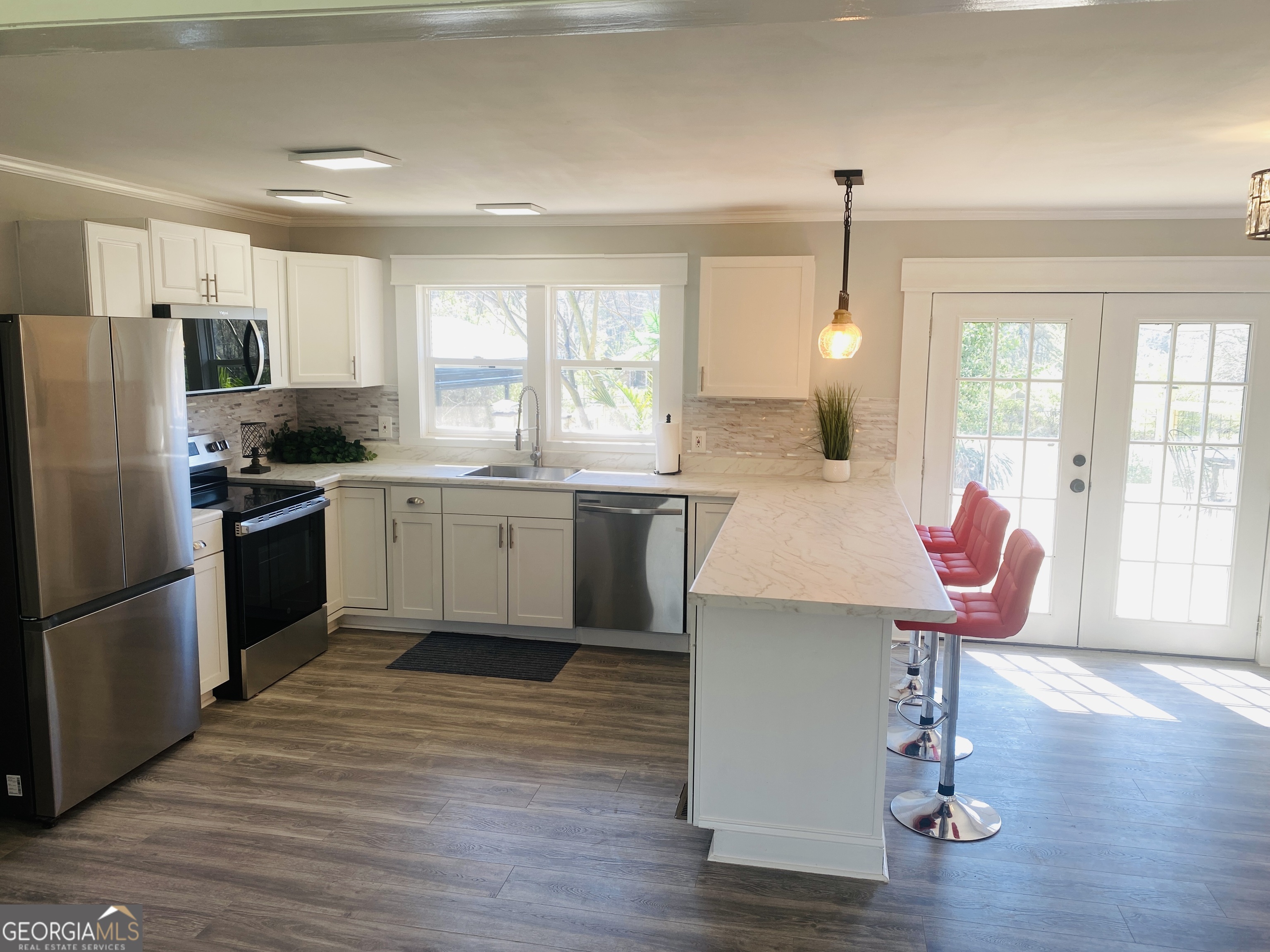 288 Davis Avenue Toccoa, GA 30577 - Photo 20 of 36 a kitchen with stainless steel appliances granite countertop a sink stove refrigerator and cabinets