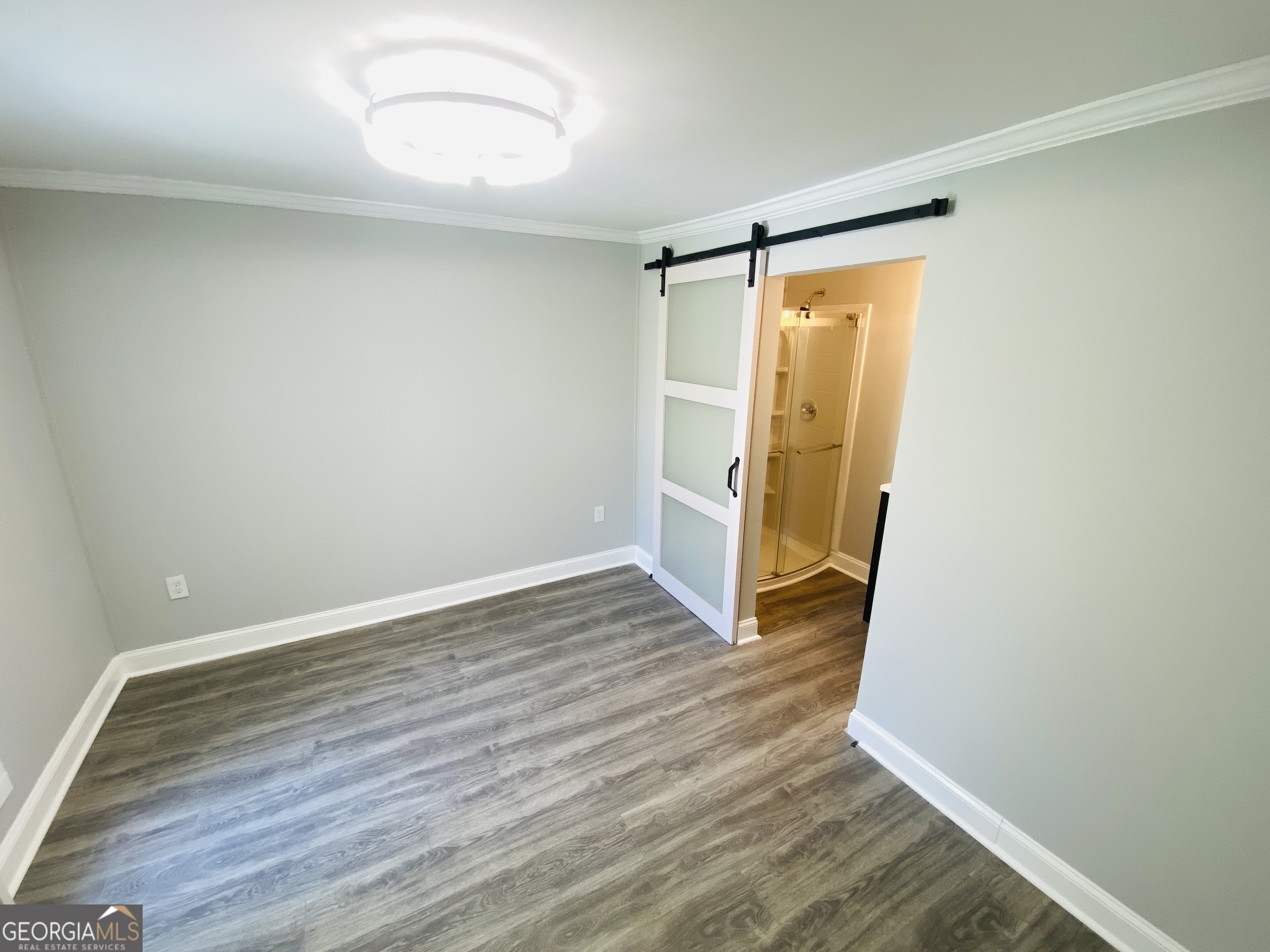 288 Davis Avenue Toccoa, GA 30577 - Photo 24 of 36 an empty room with wooden floor and window