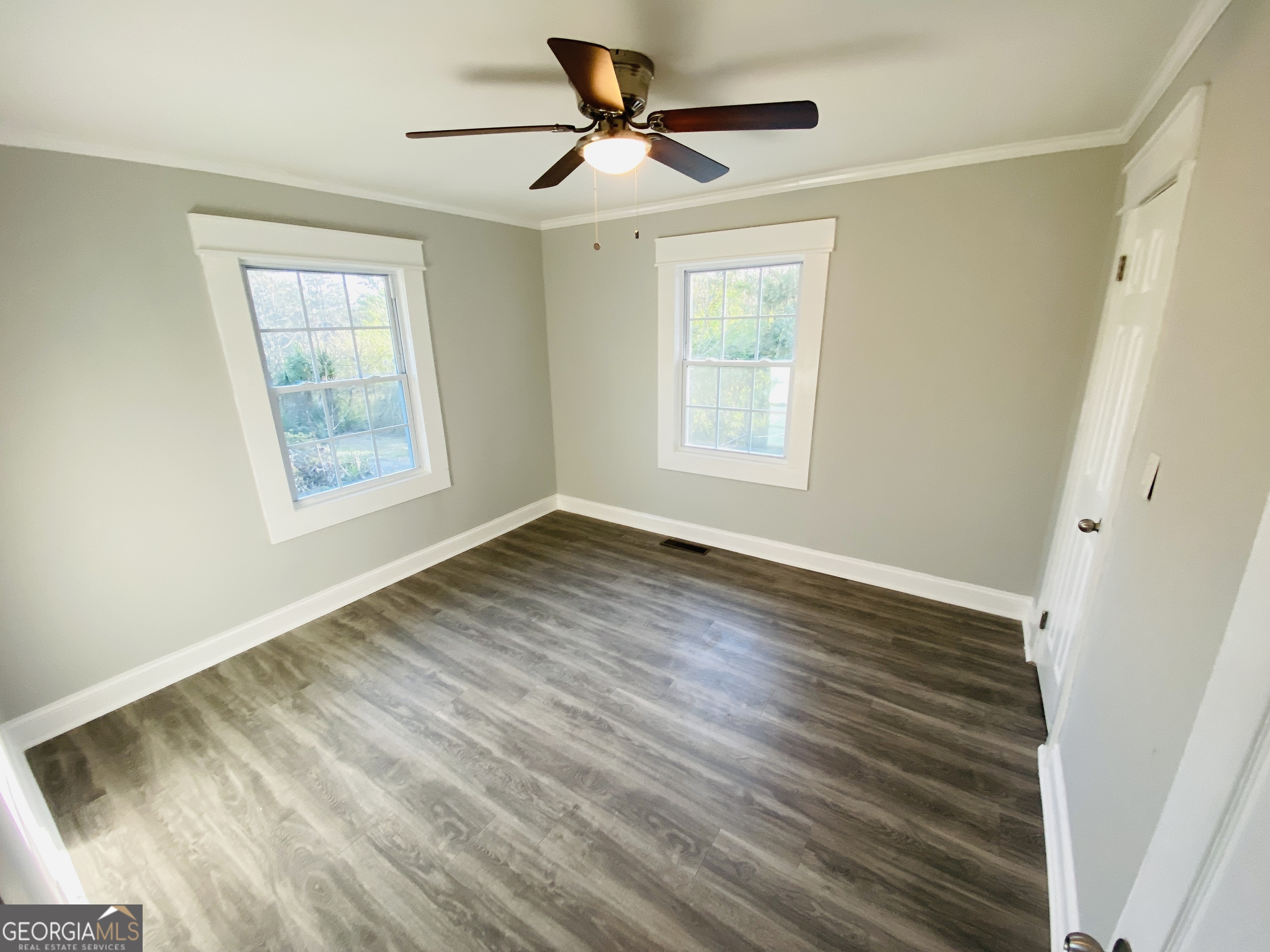 288 Davis Avenue Toccoa, GA 30577 - Photo 26 of 36 a view of an empty room with wooden floor and a window