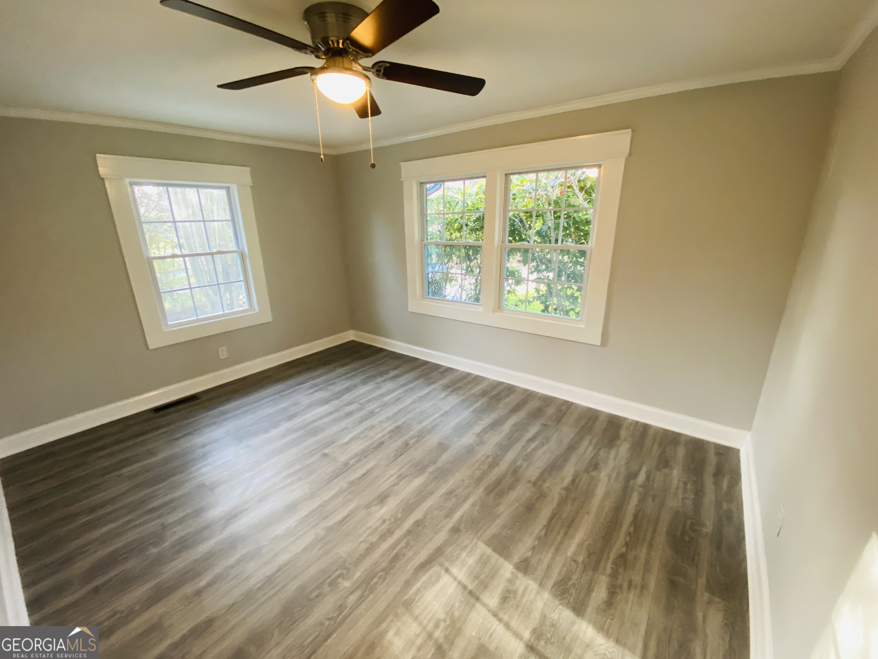288 Davis Avenue Toccoa, GA 30577 - Photo 27 of 36 a view of an empty room with wooden floor and a window