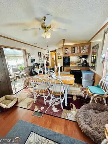 a view of a livingroom with furniture and a table