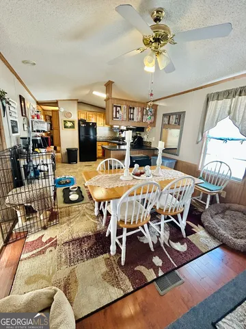 a view of a livingroom with furniture and a table