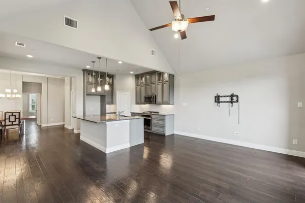 a view of kitchen with sink microwave and stove