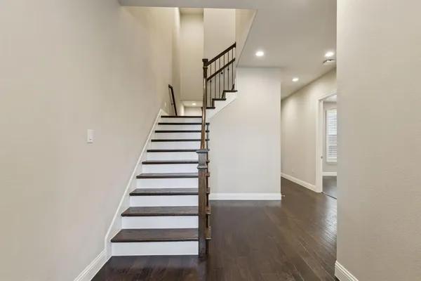 a view of entryway with wooden floor