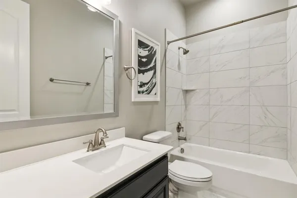 a bathroom with a sink a toilet and a bathtub