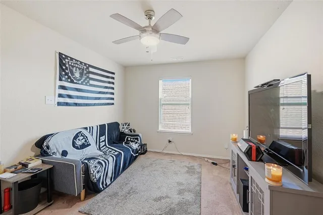 a bedroom with bed and a window