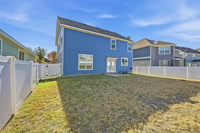 a house view with a backyard space