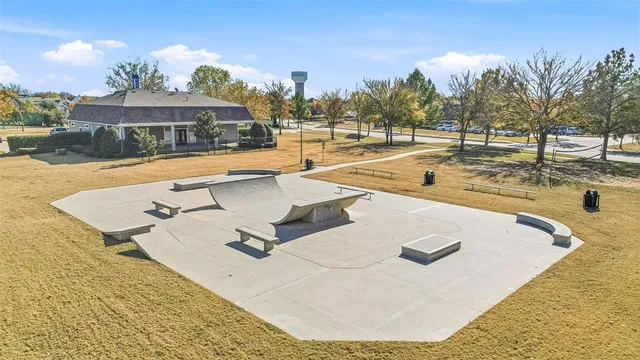 a view of a swimming pool with an outdoor seating