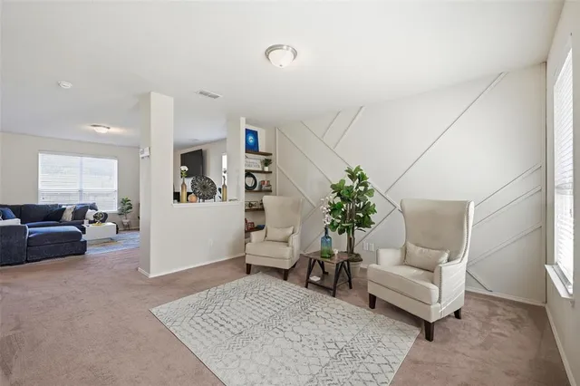 a living room with furniture and a couch