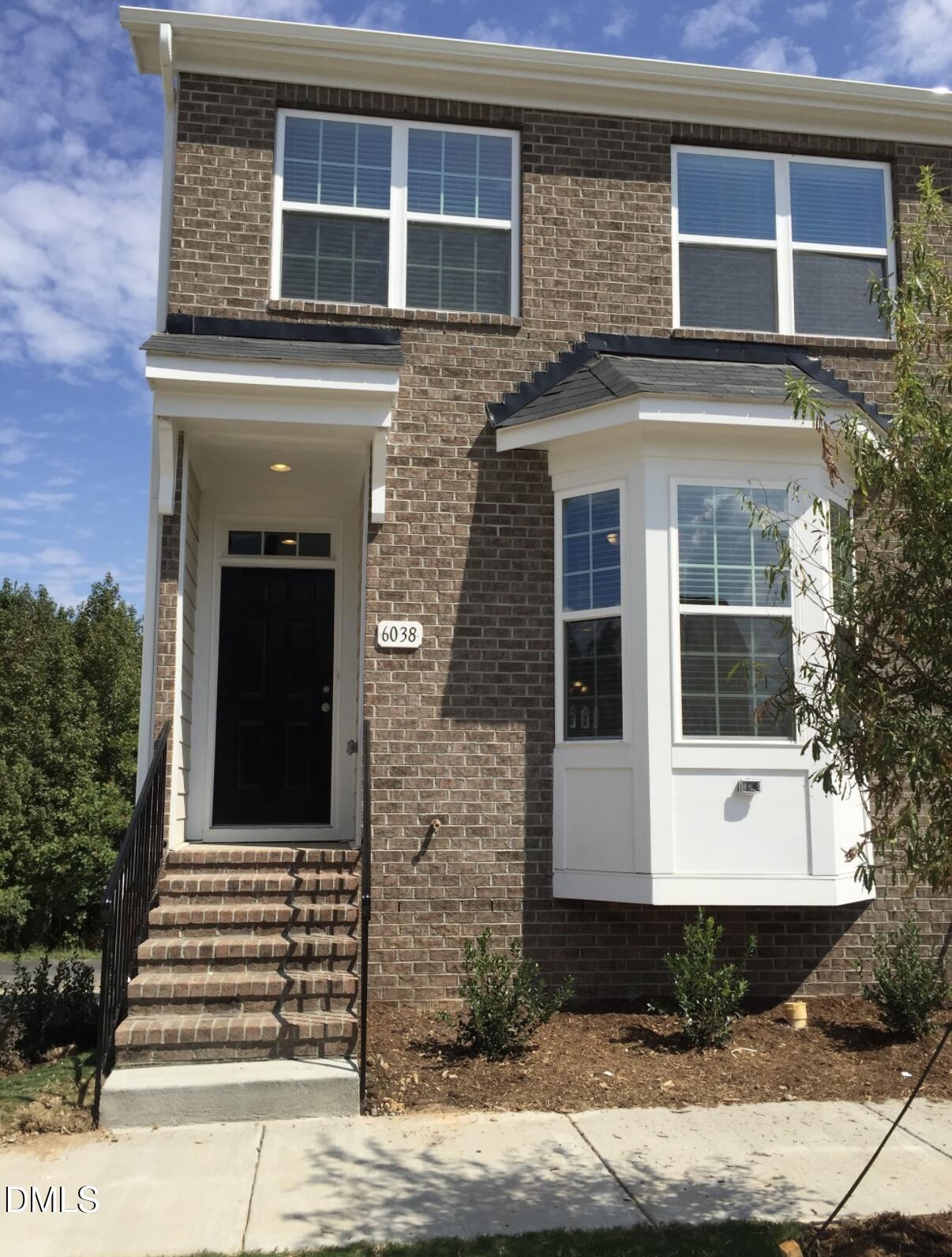 6038 Kentworth Drive Holly Springs, NC 27540 - Photo 1 of 10 a front view of a house