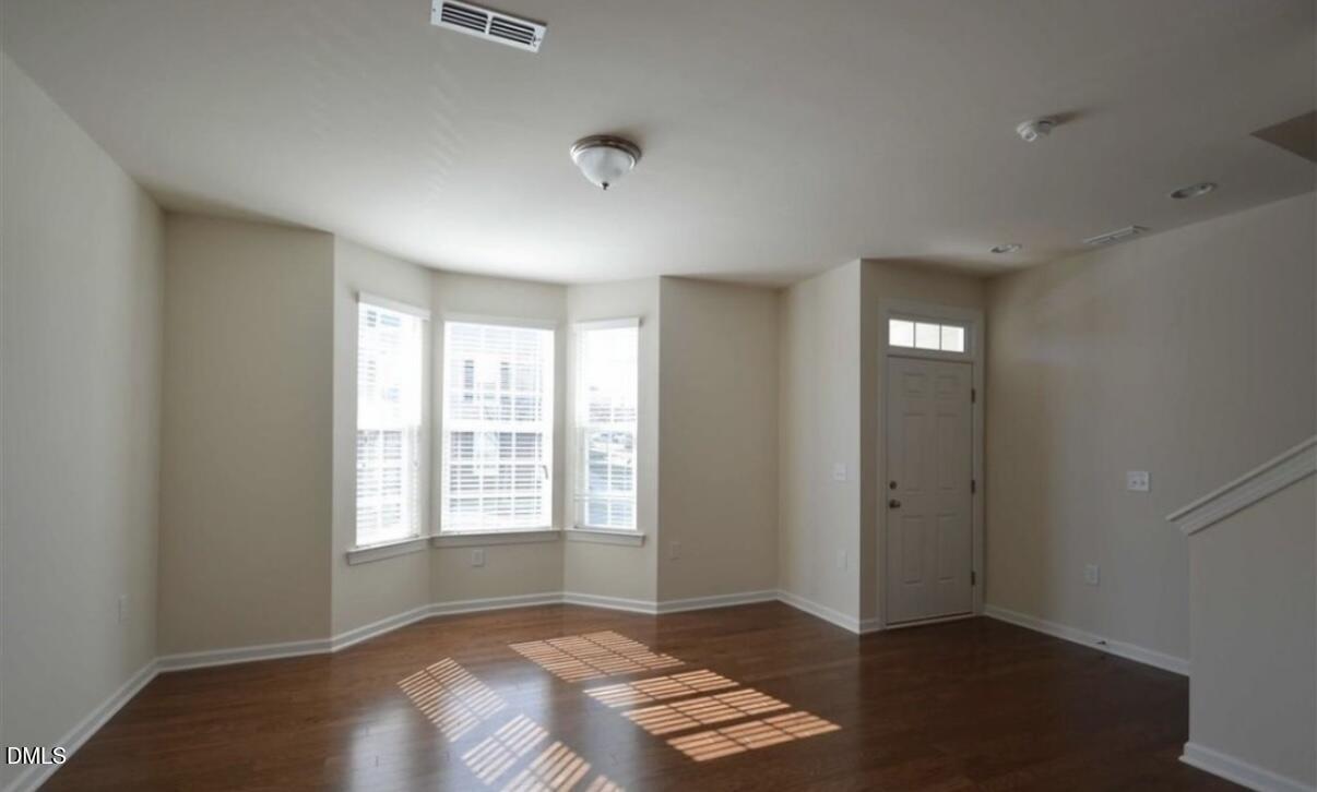 6038 Kentworth Drive Holly Springs, NC 27540 - Photo 2 of 10 an empty room with windows
