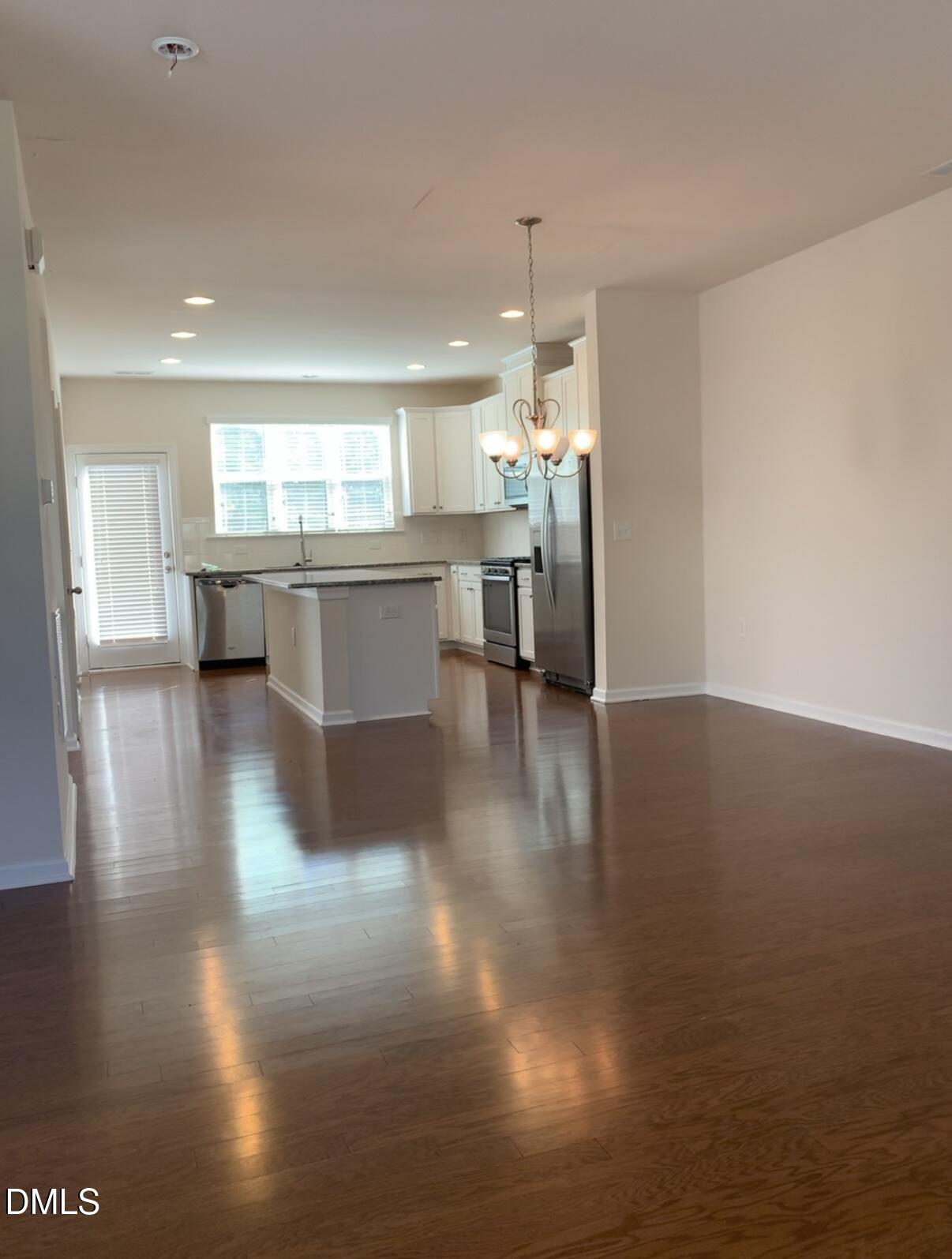 6038 Kentworth Drive Holly Springs, NC 27540 - Photo 3 of 10 a view of kitchen with sink and refrigerator