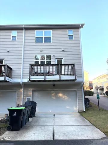 a balcony with furniture and a potted plant