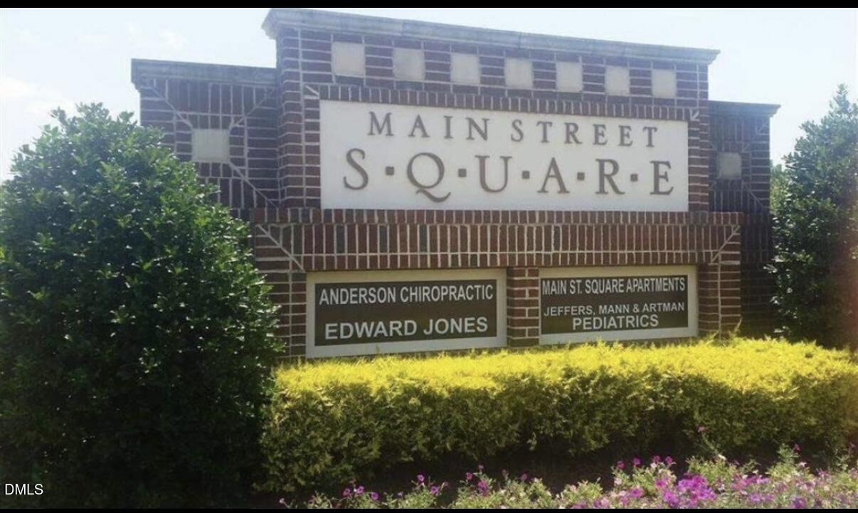 6038 Kentworth Drive Holly Springs, NC 27540 - Photo 8 of 10 a sign on the side of building