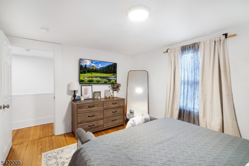 60 Searing Street Dover, NJ 07801 - Photo 15 of 23 a bedroom with a bed and furniture