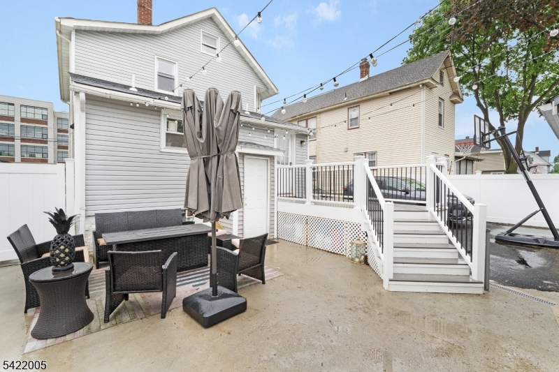 60 Searing Street Dover, NJ 07801 - Photo 23 of 23 a view of a patio with table and chairs