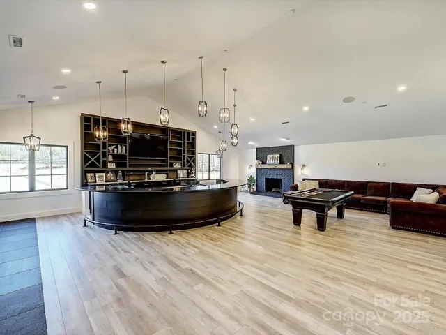 a living room with hard wood flooring