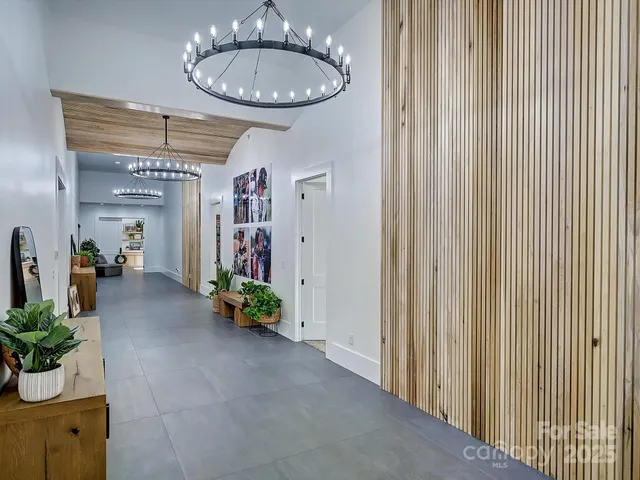 a living room with furniture potted plant and a window