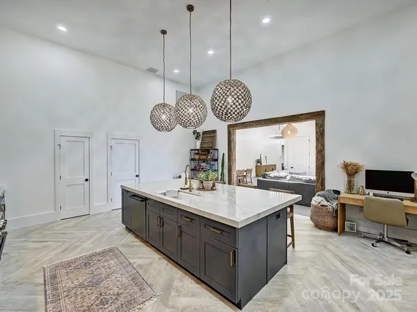 a kitchen with a table and chairs in it