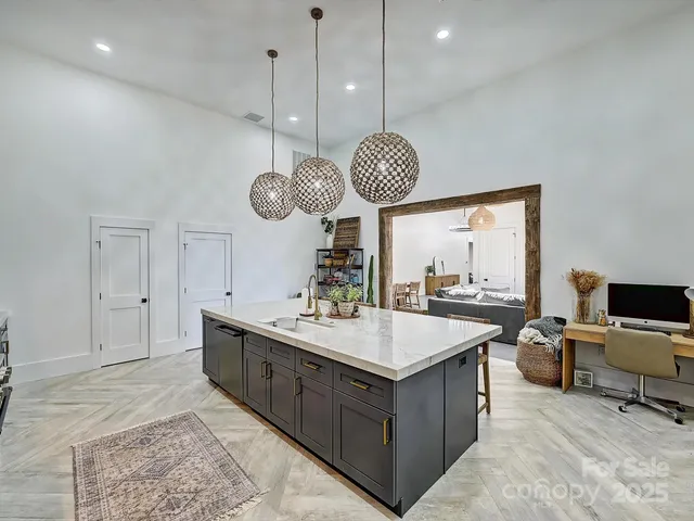 a kitchen with a table and chairs in it