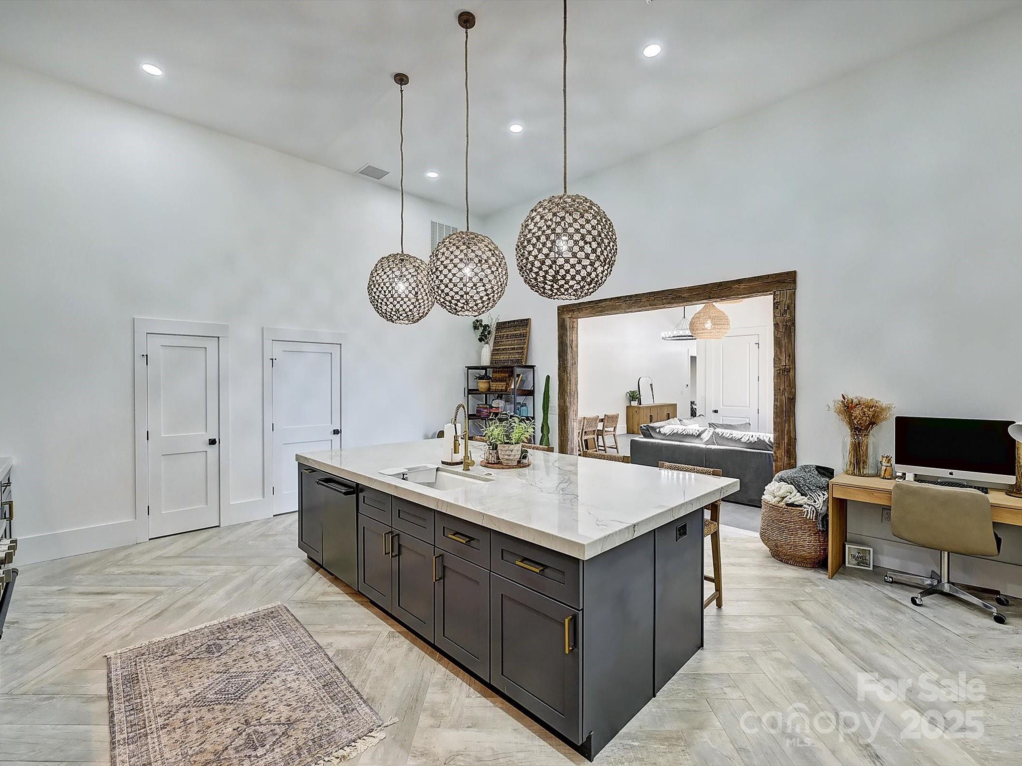 1525 Shinnville Road Cleveland, NC 27013 - Photo 22 of 48 a room with a chandelier a sink and a clock
