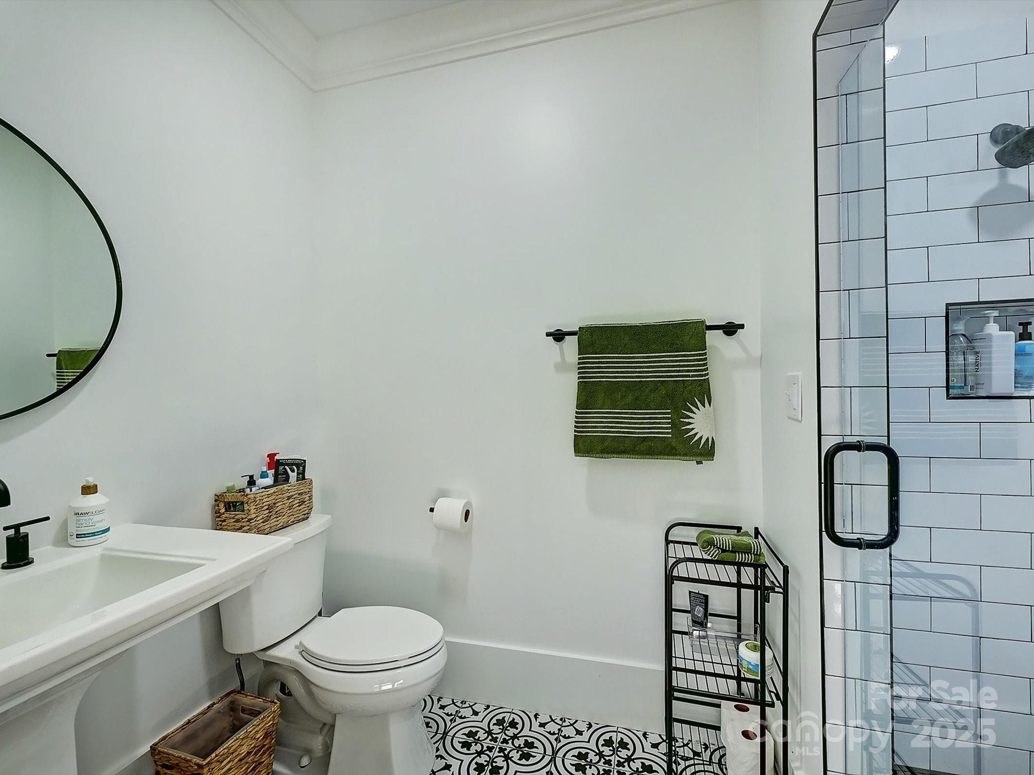 1525 Shinnville Road Cleveland, NC 27013 - Photo 26 of 48 a bathroom with a toilet and a sink