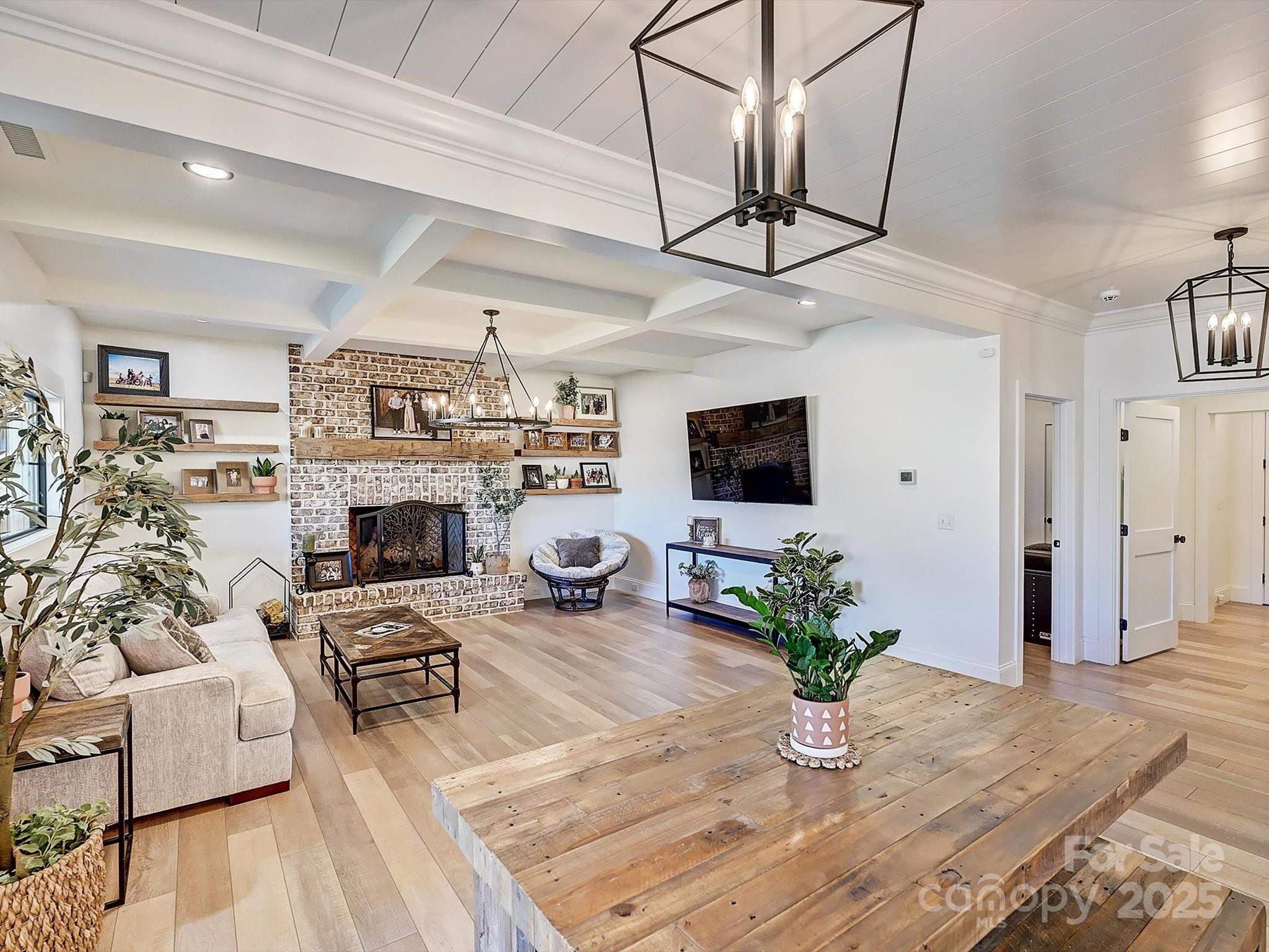 1525 Shinnville Road Cleveland, NC 27013 - Photo 3 of 48 a living room with furniture a fireplace and a flat screen tv
