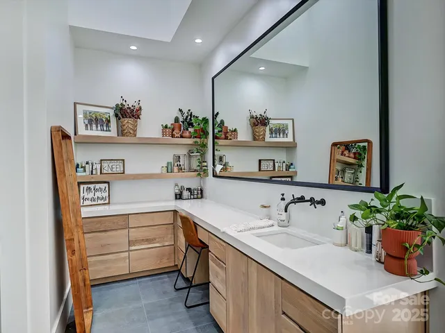 a view of living room with wooden floor and windows